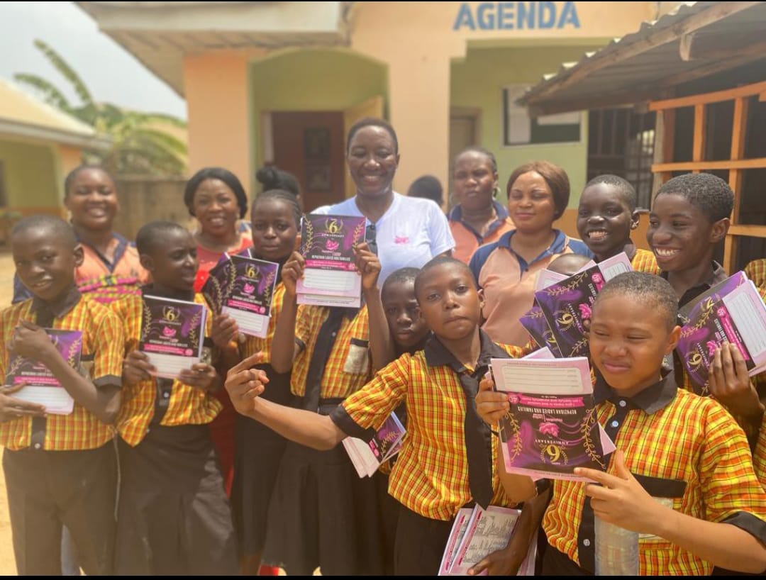 Children receiving notebooks