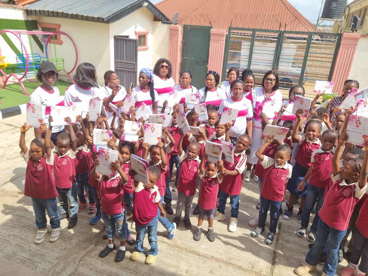 Foundation members and children at an education outreach