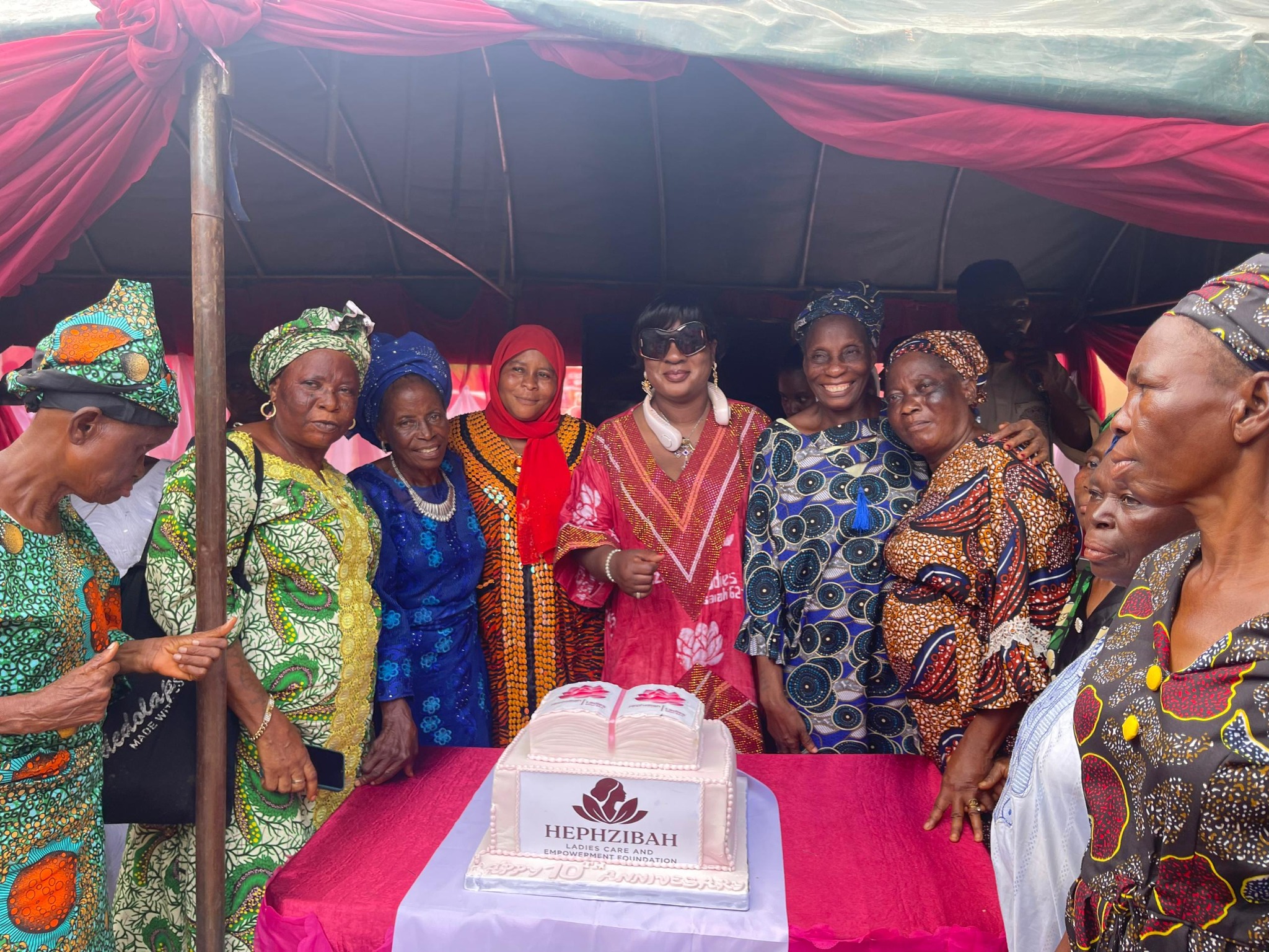 Founder with elderly women in the community